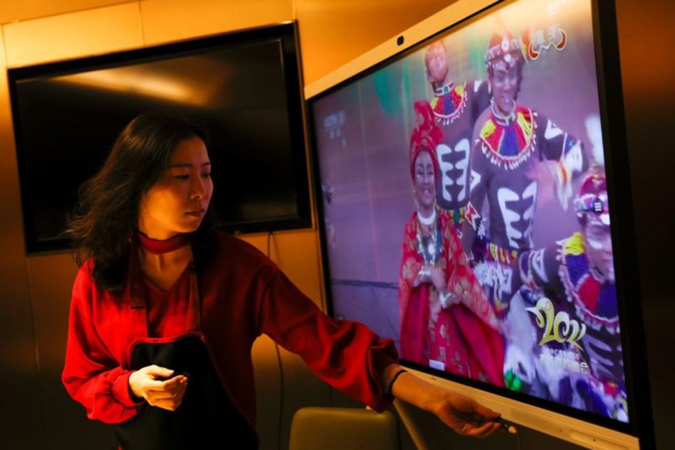 Liu Yuting watches the lunar new year gala after dinner with her family in Beijing