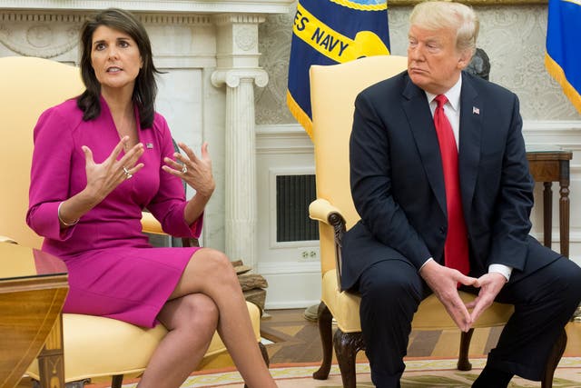 <p>Nikki Haley (L) speaks beside US President Donald J Trump (R) in the Oval Office of the White House in Washington, DC, on 9 October 2018</p>