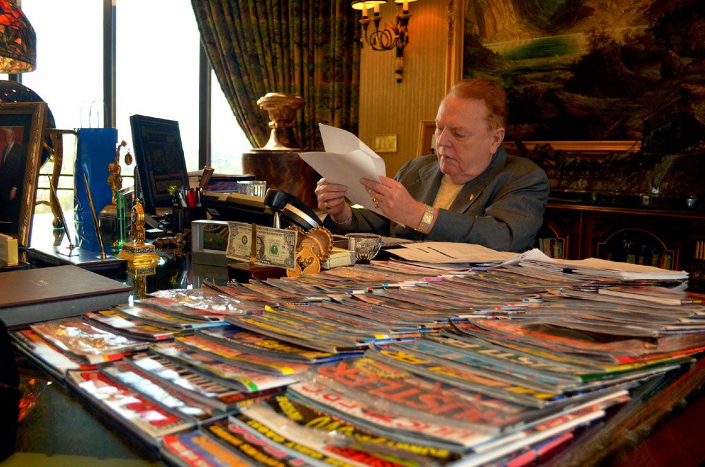 A stack of ‘Hustler' back copies rest atop Larry Flynt’s desk in October 2011.