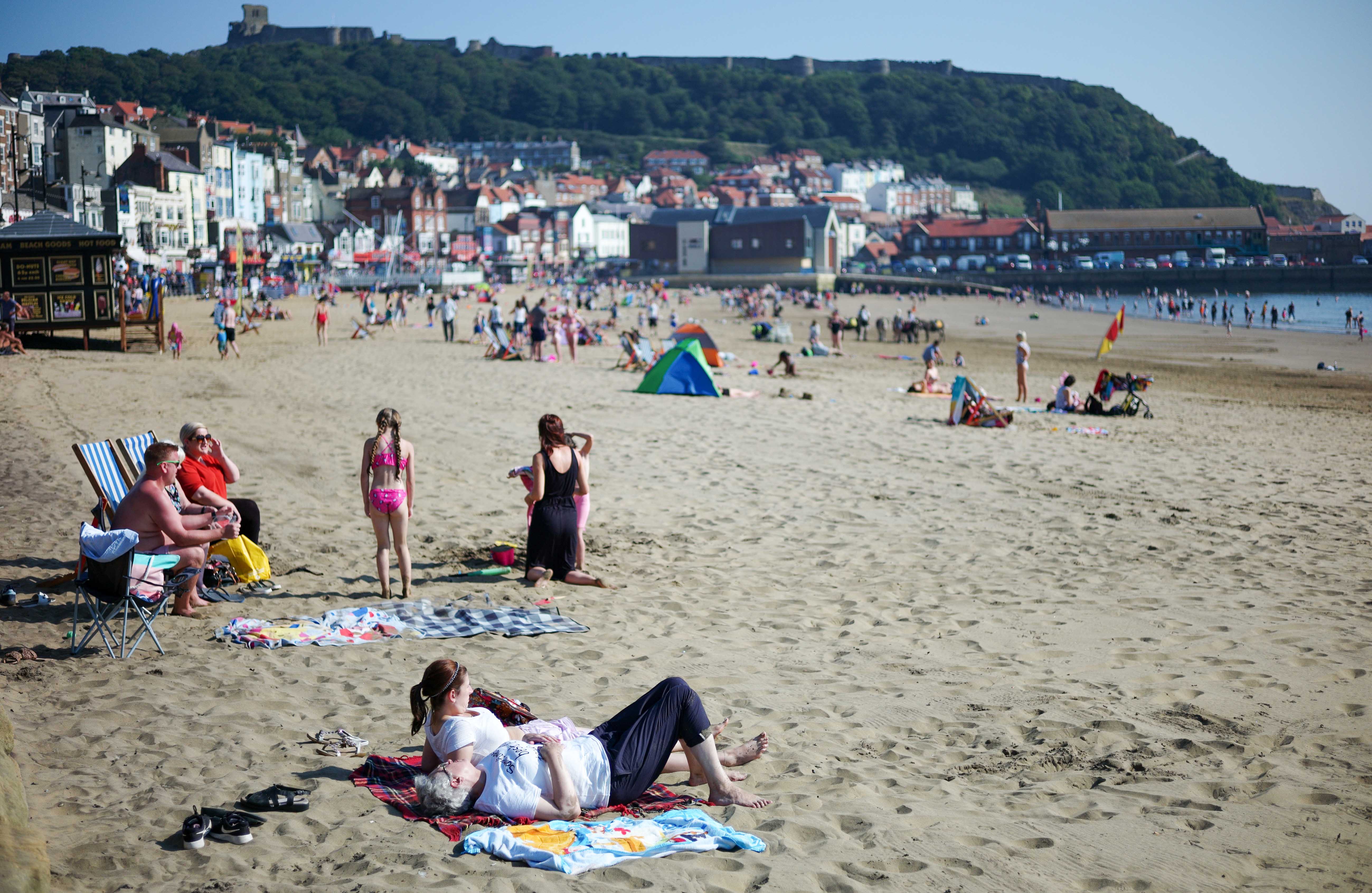 Families enjoy Scarborough beach in August 2019