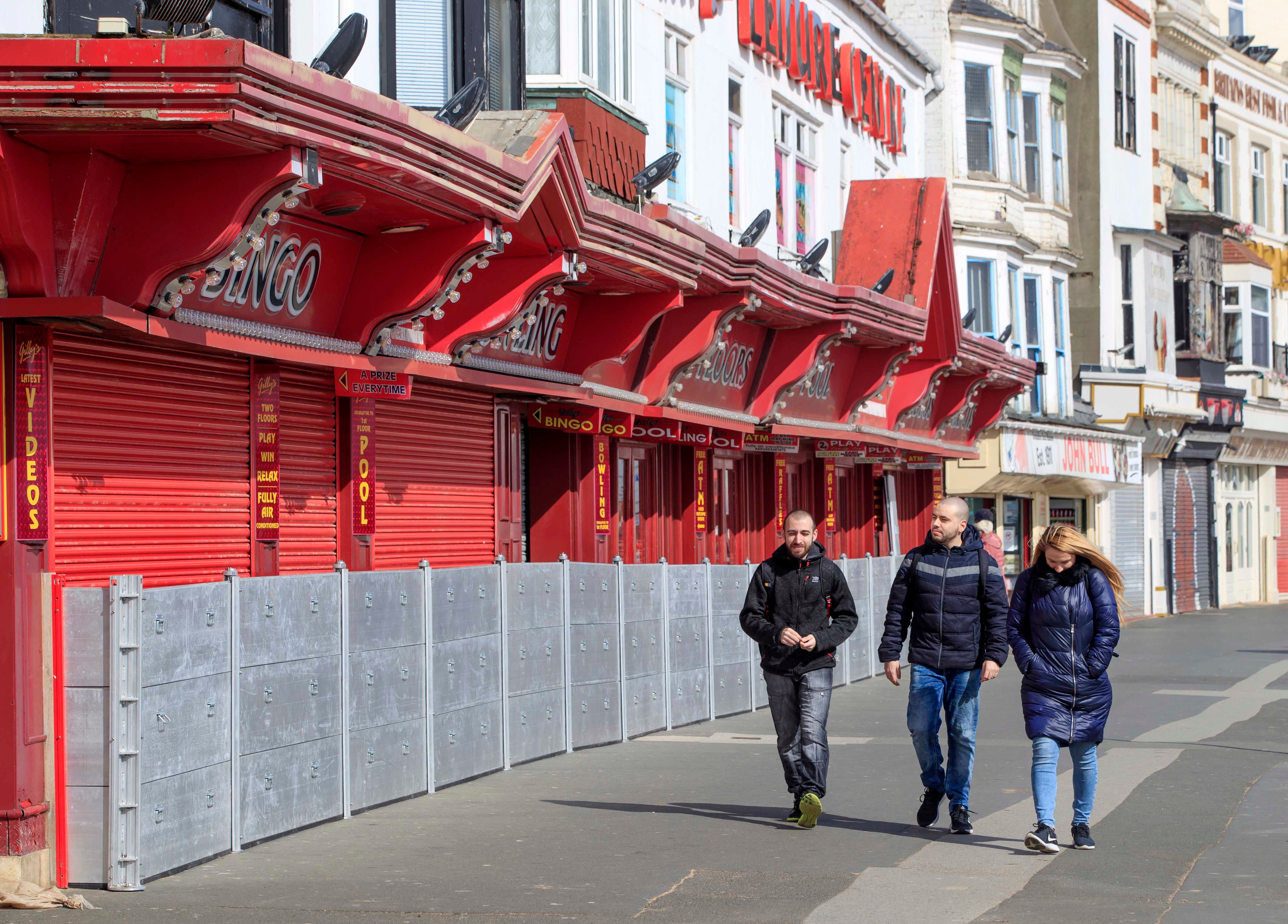 Amusement arcades, closed under coronavirus restrictions, line the seafront in Scarborough