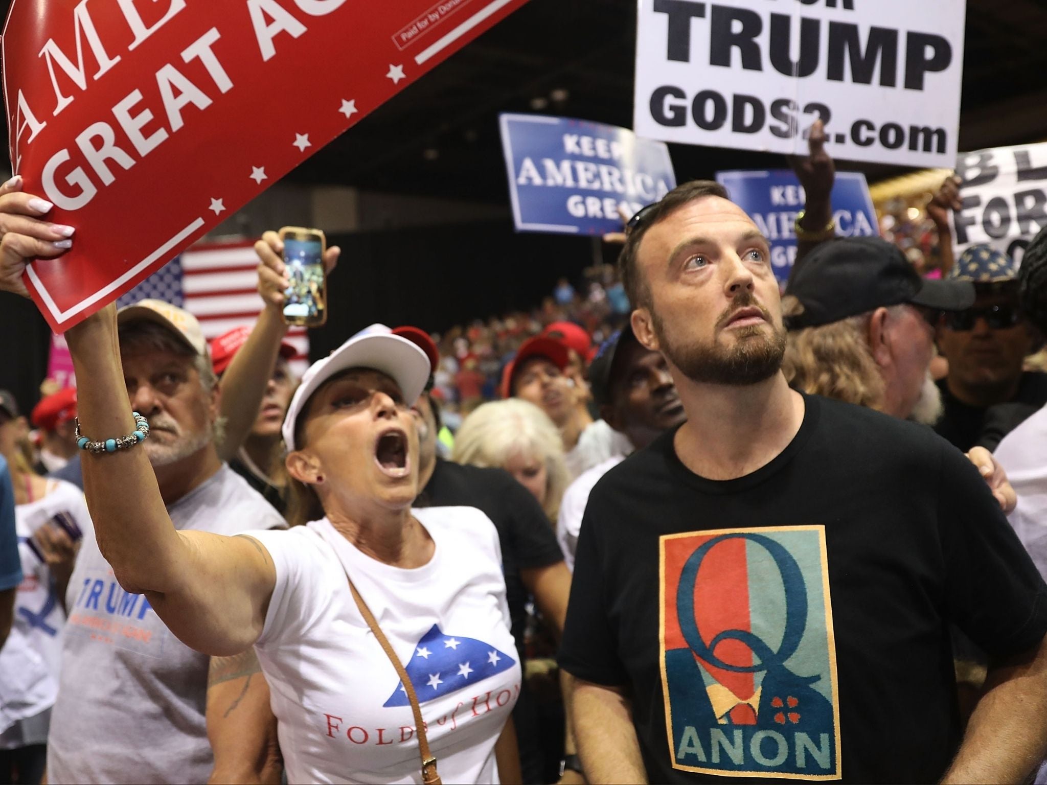 A man wearing a Q Anon shirt attends a rally for President Donald Trump at the Florida State Fair Grounds Expo Hall on July 31, 2018 in Tampa, Florida.