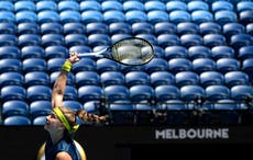 Australian Open goes quiet as lockdown keeps crowds away 