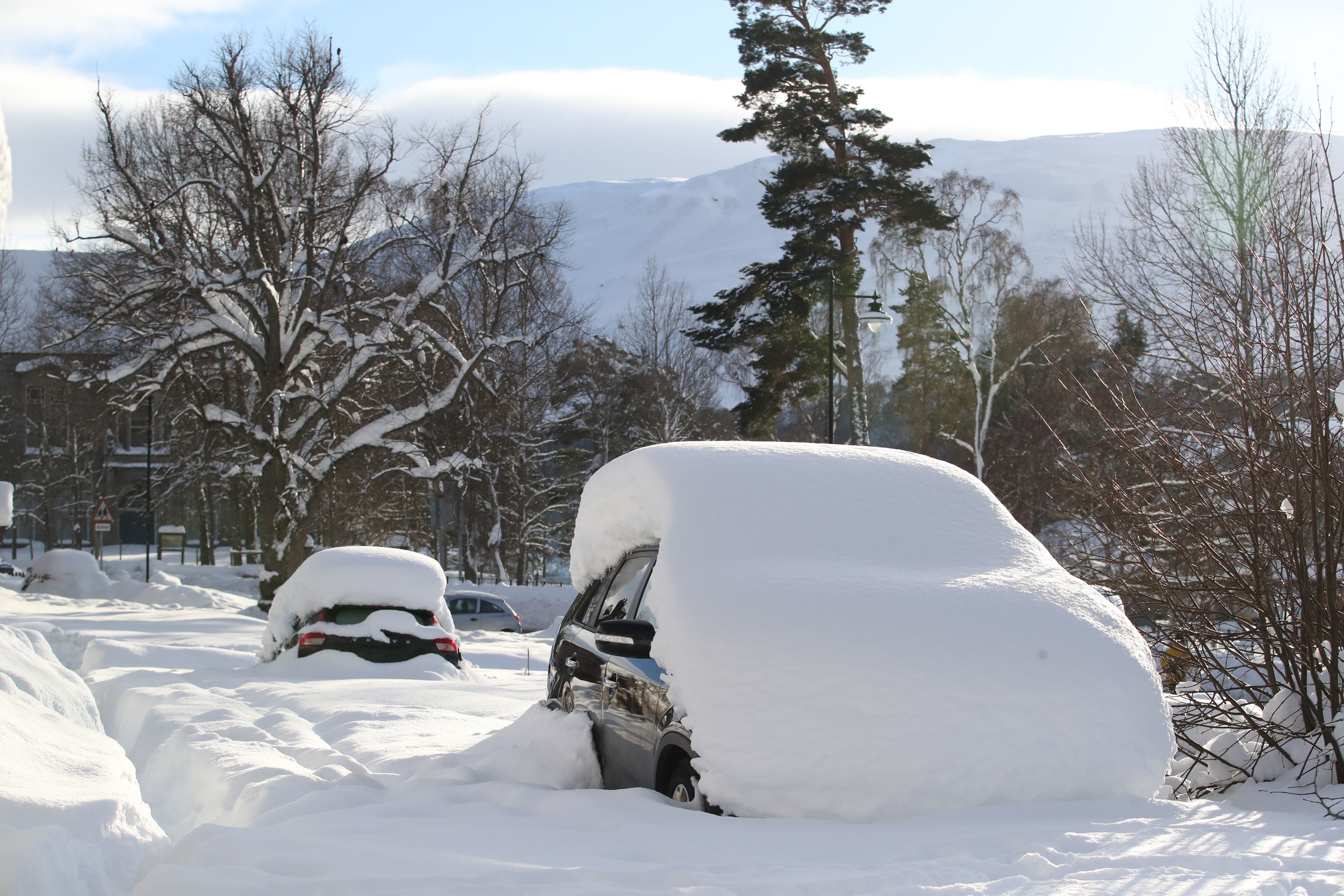 Parked cars in snow covered Castleton Terrace in Braemar, Aberdeenshire, which had an overnight temperature of minus 23.0C