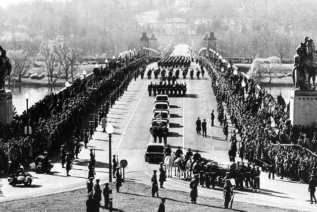 <p>The funeral procession of President John F Kennedy goes into Arlington Cemetery in Washington on 25 November 1963</p>