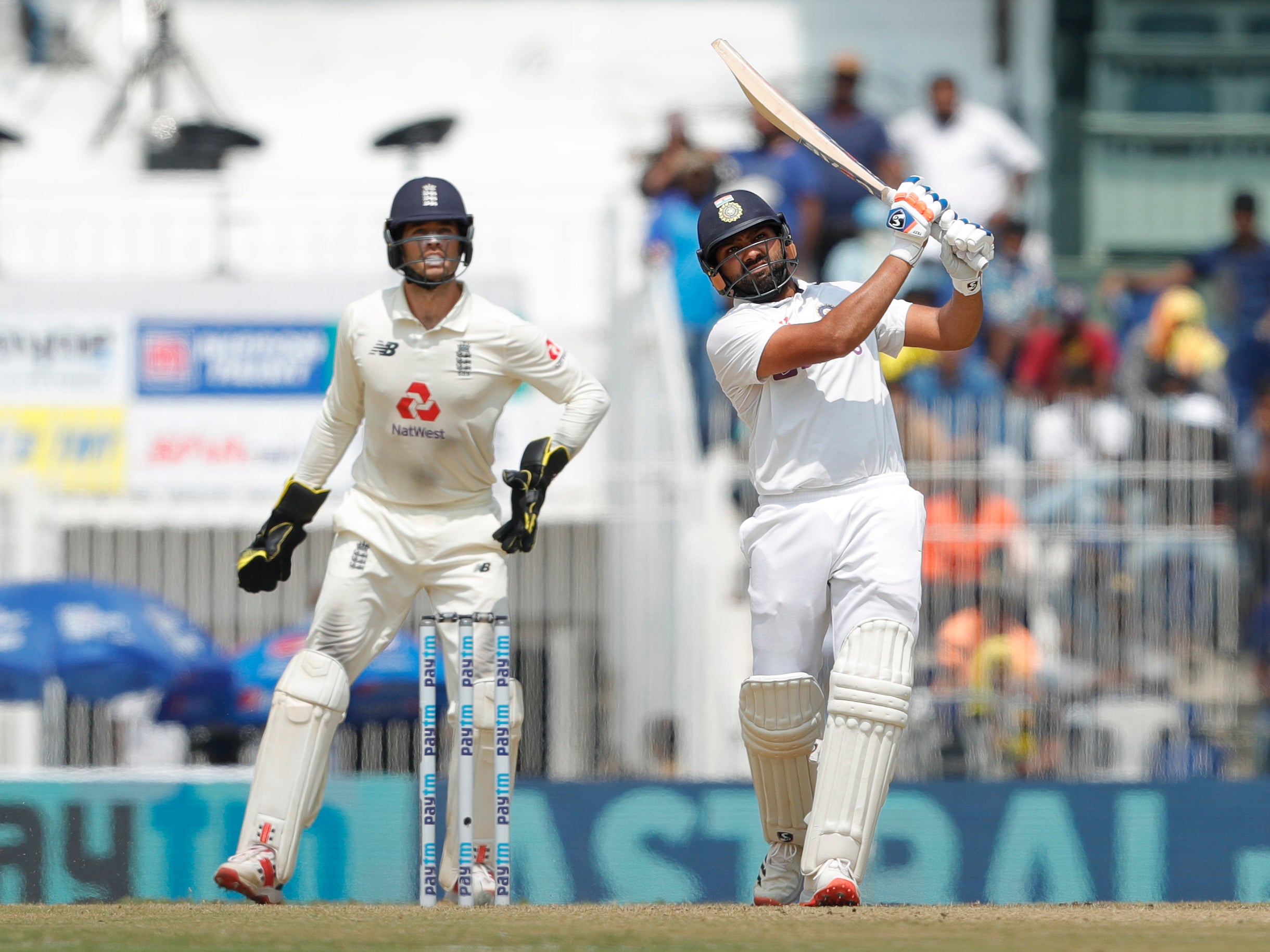 Rohit Sharma hits Moeen Ali to the boundary on day one