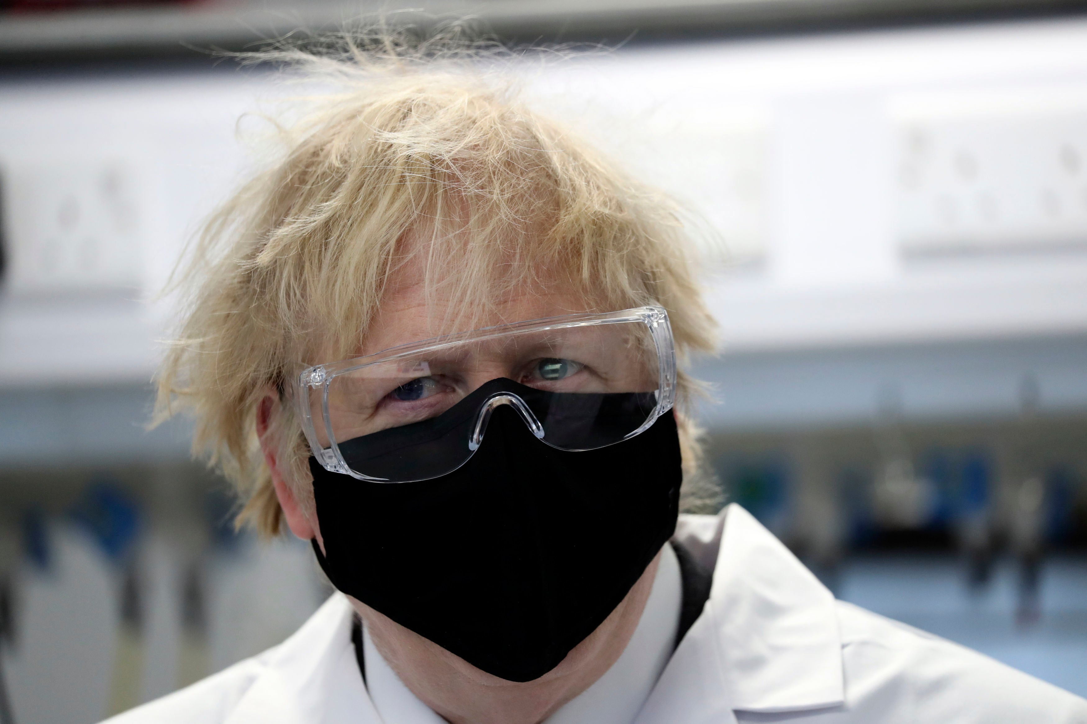 Boris Johnson, wearing a face mask, during a visit to a pharmaceutical manufacturing facility in Stockton-on-Tees