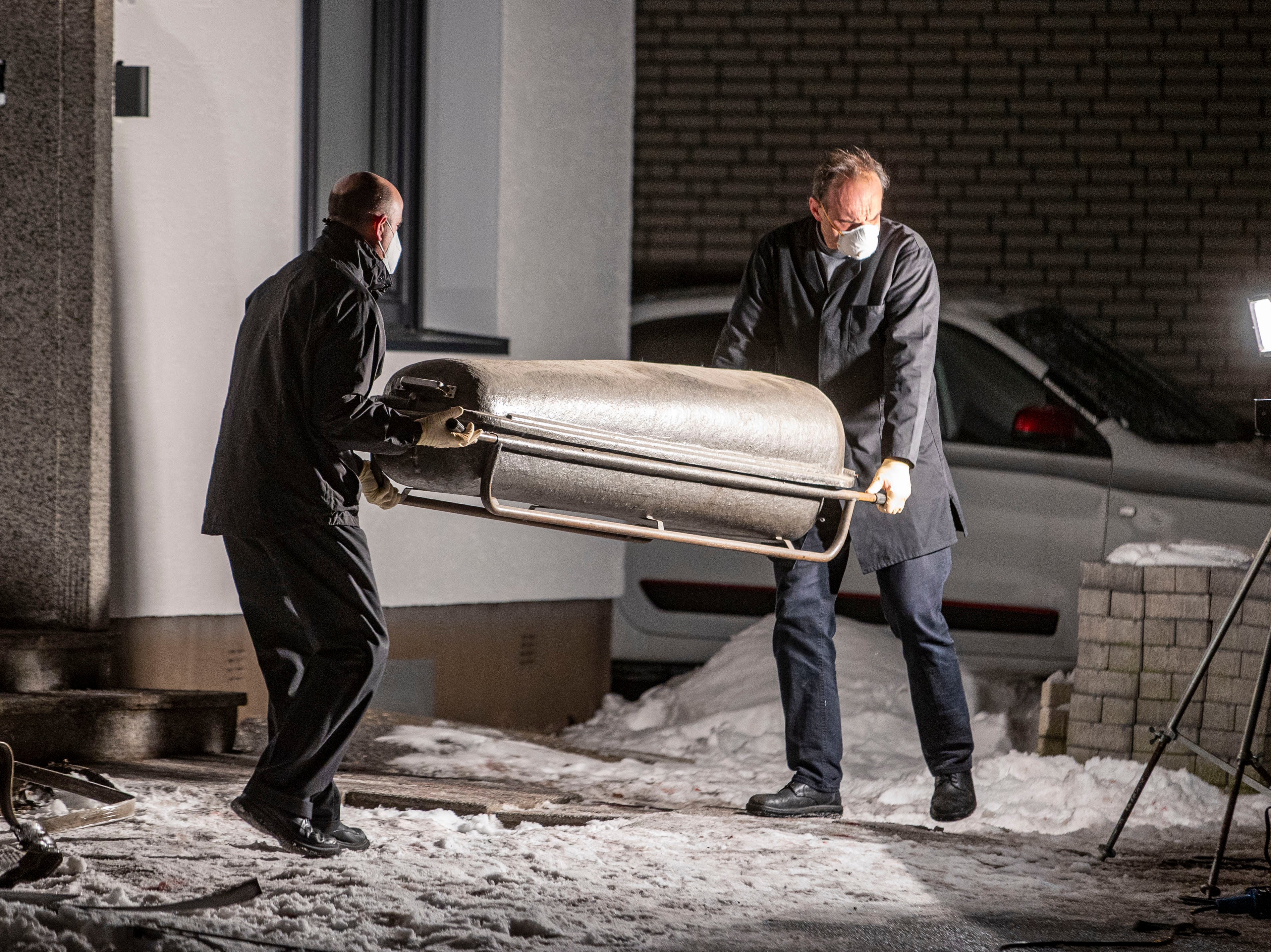 A coffin is carried out of a house in Radevormwald, western Germany, after the fire