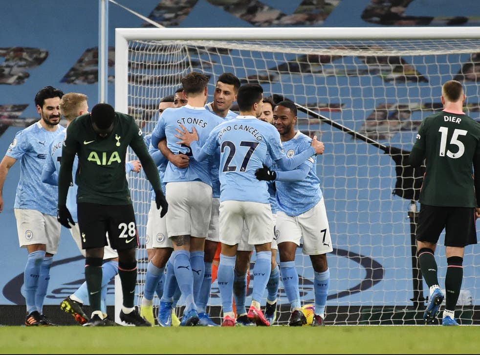 Man City celebrate scoring against Spurs