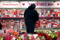 A bleak Valentine's Day, lovers find hope in roses, vaccines