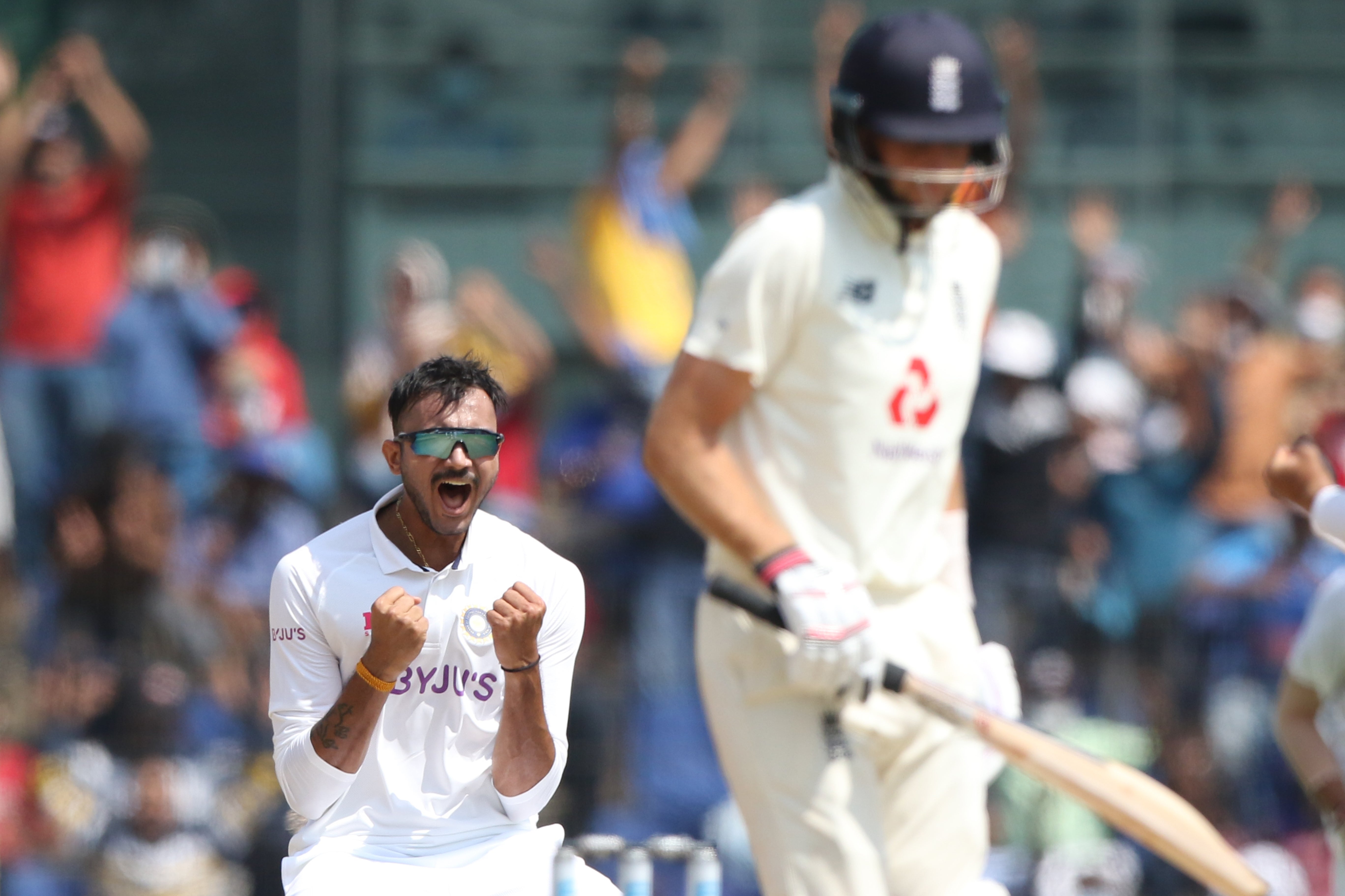 Axar Patel of India celebrates the wicket of Joe Root