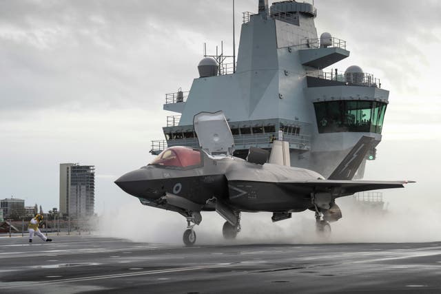 An RAF F-35B Lightning jet preparing to take off from the flight deck of the Royal Navy aircraft carrier HMS Queen Elizabeth