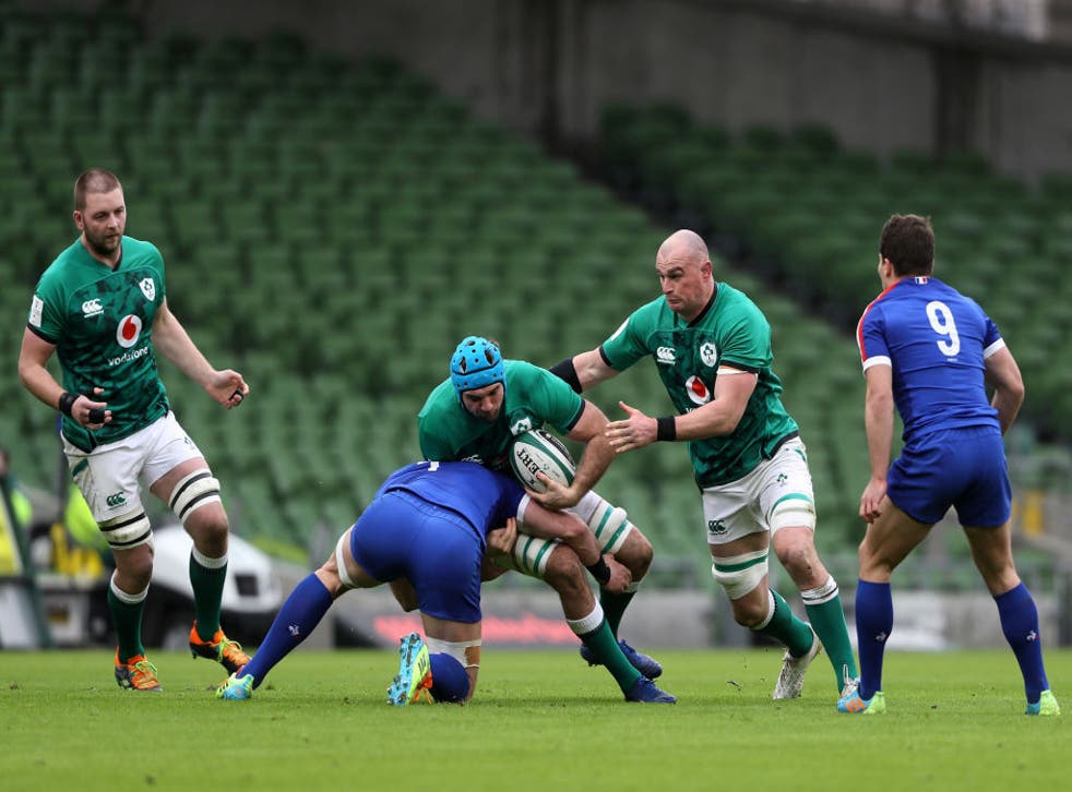 Tadhg Beirne of Ireland is tackled by Charles Ollivon of France