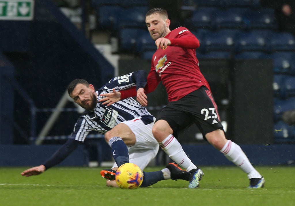 Luke Shaw in action with Robert Snodgrass
