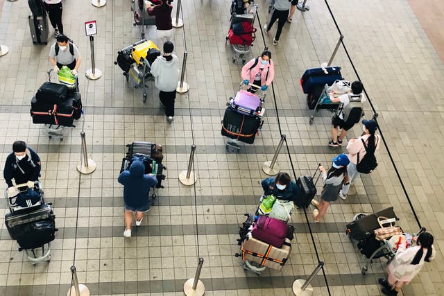 Waiting game: passengers at Heathrow airport