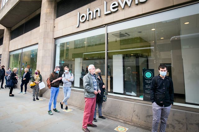 <p>People queue outside a John Lewis store in Edinburgh in July 2020 as the first lockdown was eased</p>