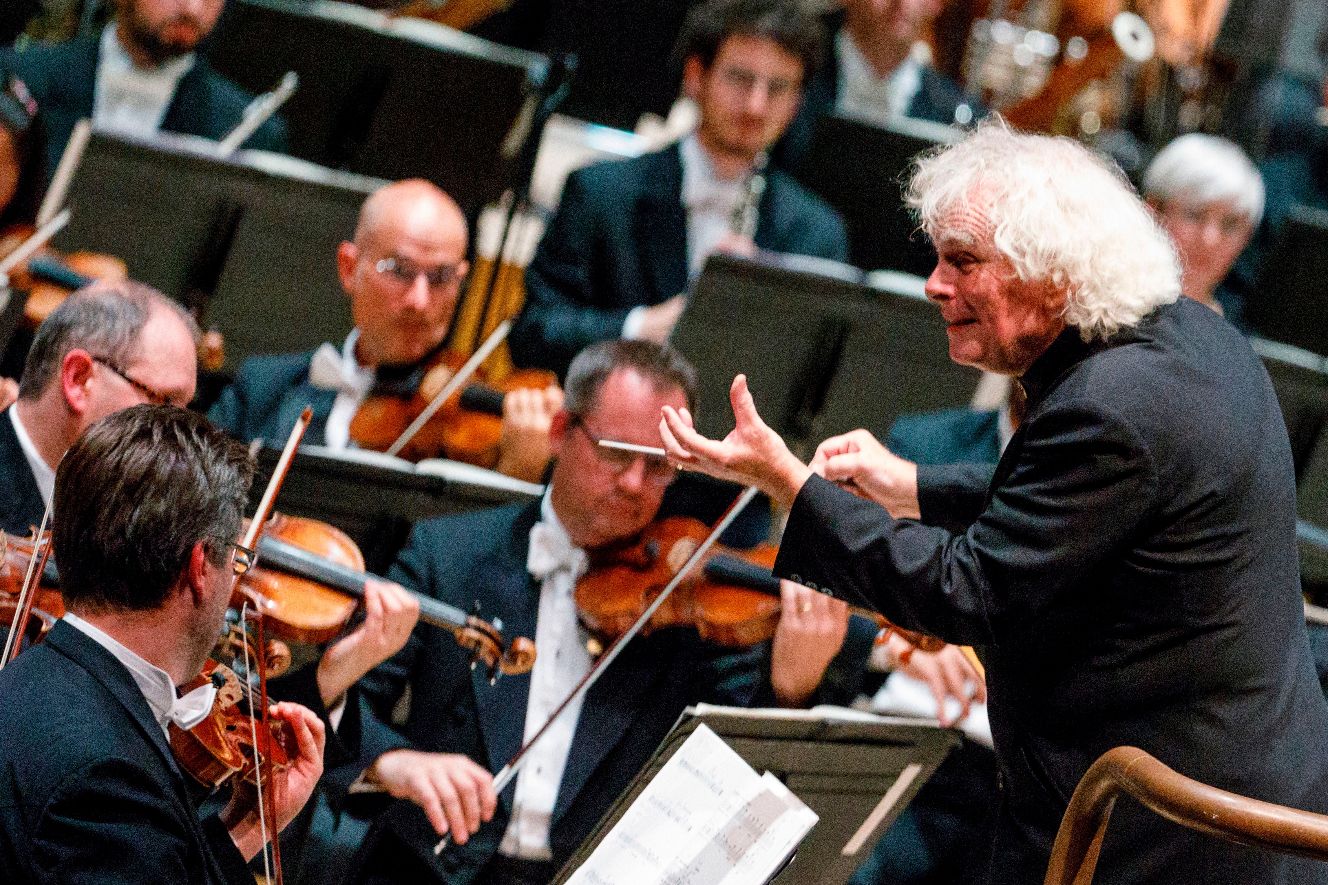 Simon Rattle conducting his first concert as head of the LSO at the Barbican in 2017