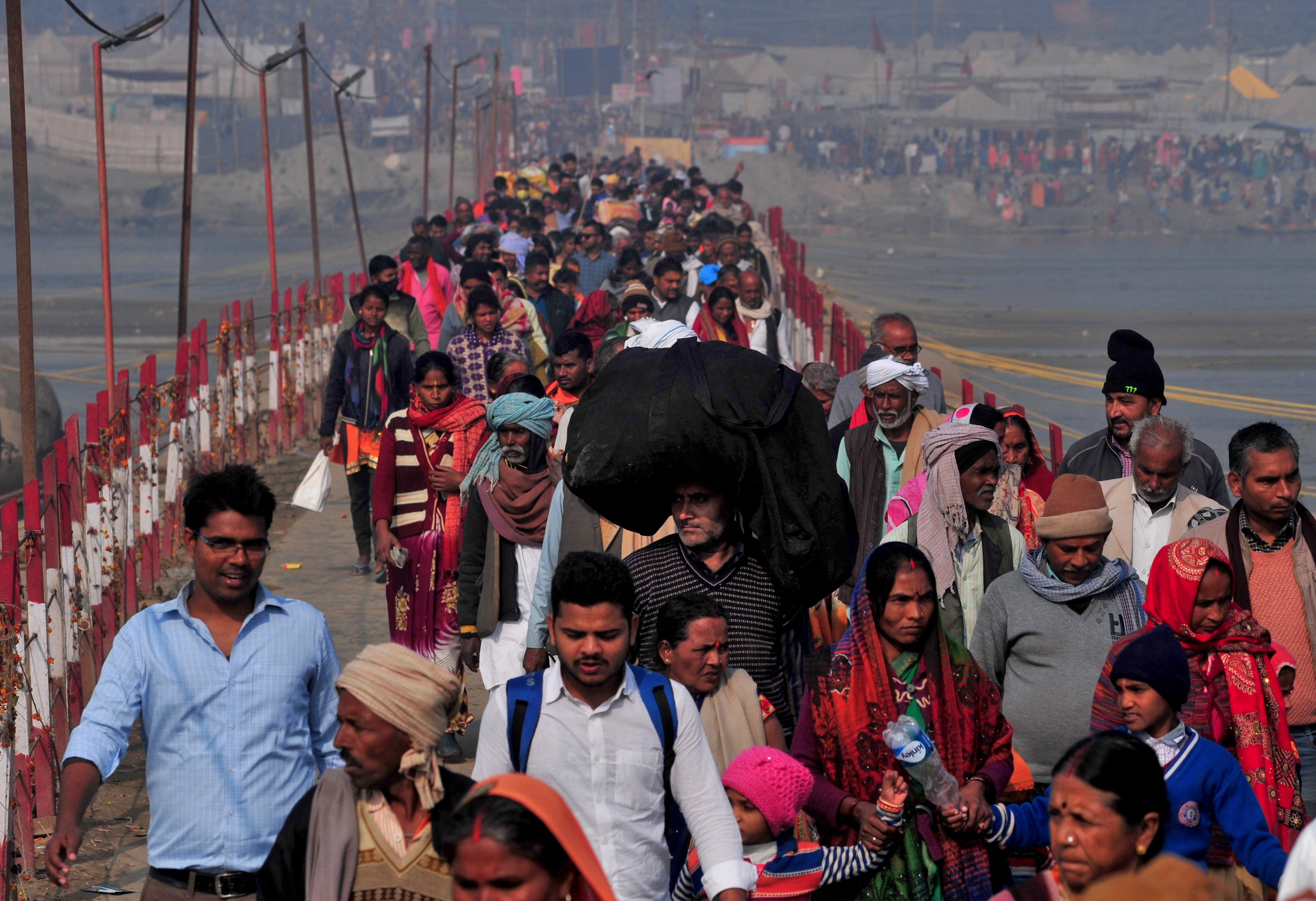 Throngs of Hindu devotees arrive to take a holy dip at Sangam in Prayagraj, India on 11 February