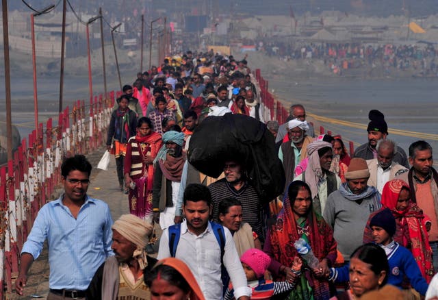 <p>Throngs of Hindu devotees arrive to take a holy dip at Sangam in Prayagraj, India on 11 February</p>