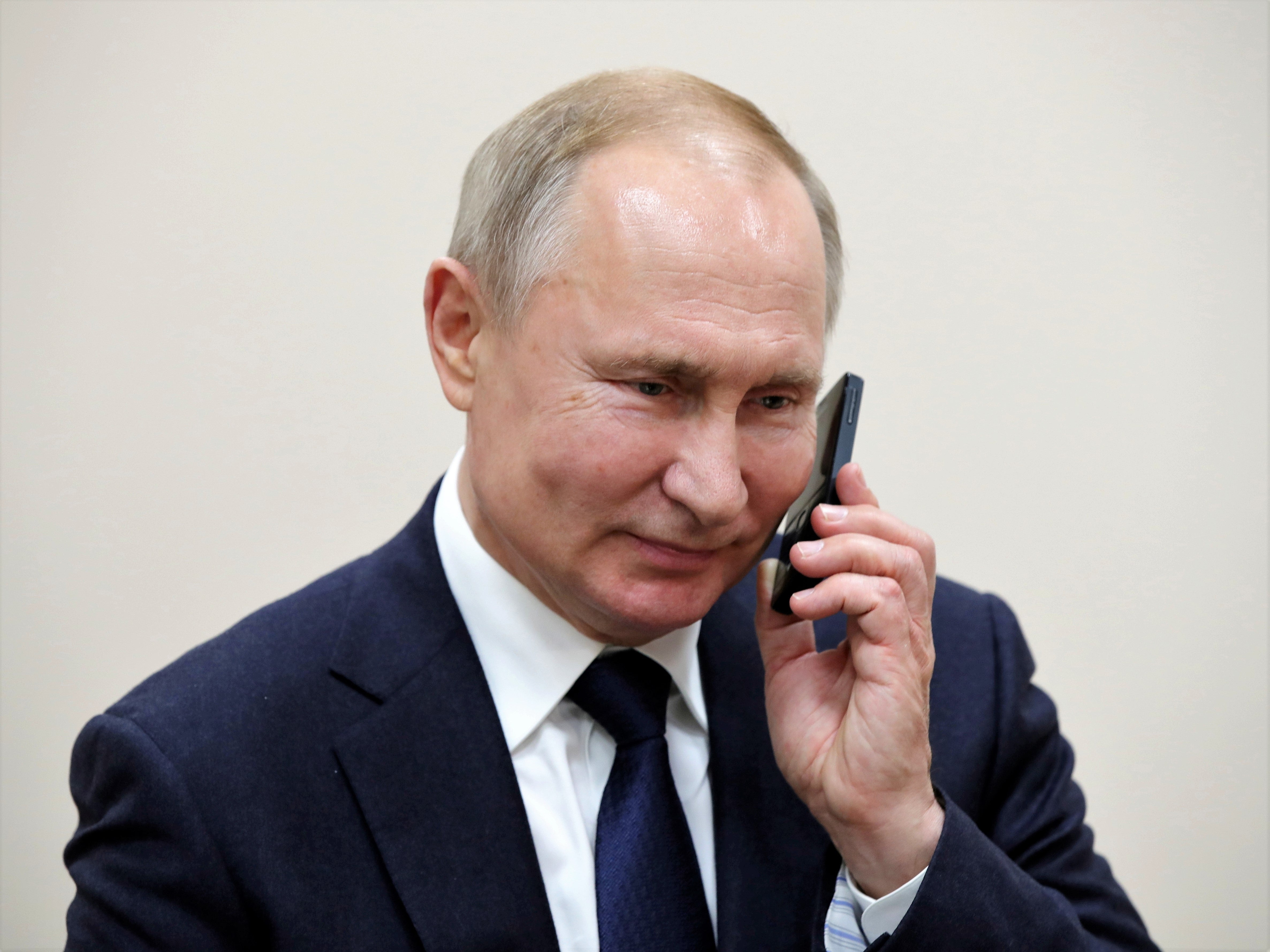 Russian President Vladimir Putin talks on the phone in the settlement of Enem, Republic of Adygea, Russia, on 23 December, 2019