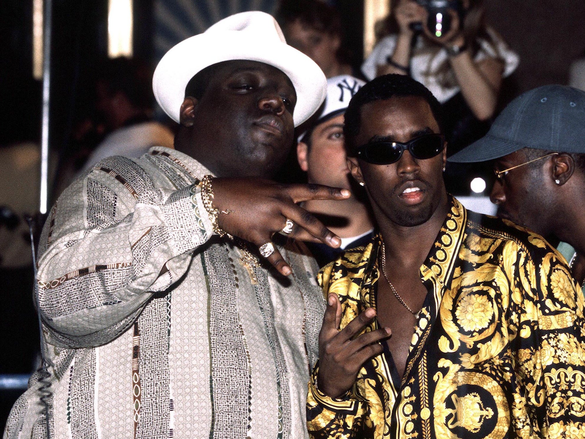 Combs is pictured with the late rapper Notorious B.I.G., who was gunned down in front of him in 1997 in an unsolved killing attributed to the East Coast-West Coast rap feud