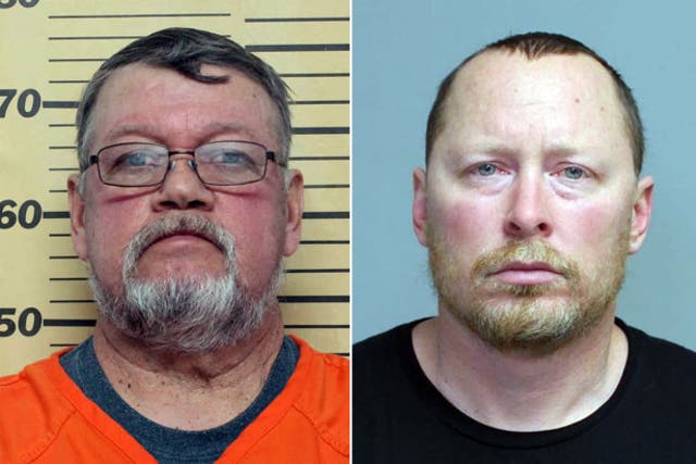 Booking photo of Mayor Mike Buum, left, and Armstrong Police Chief Craig Merrill, right.