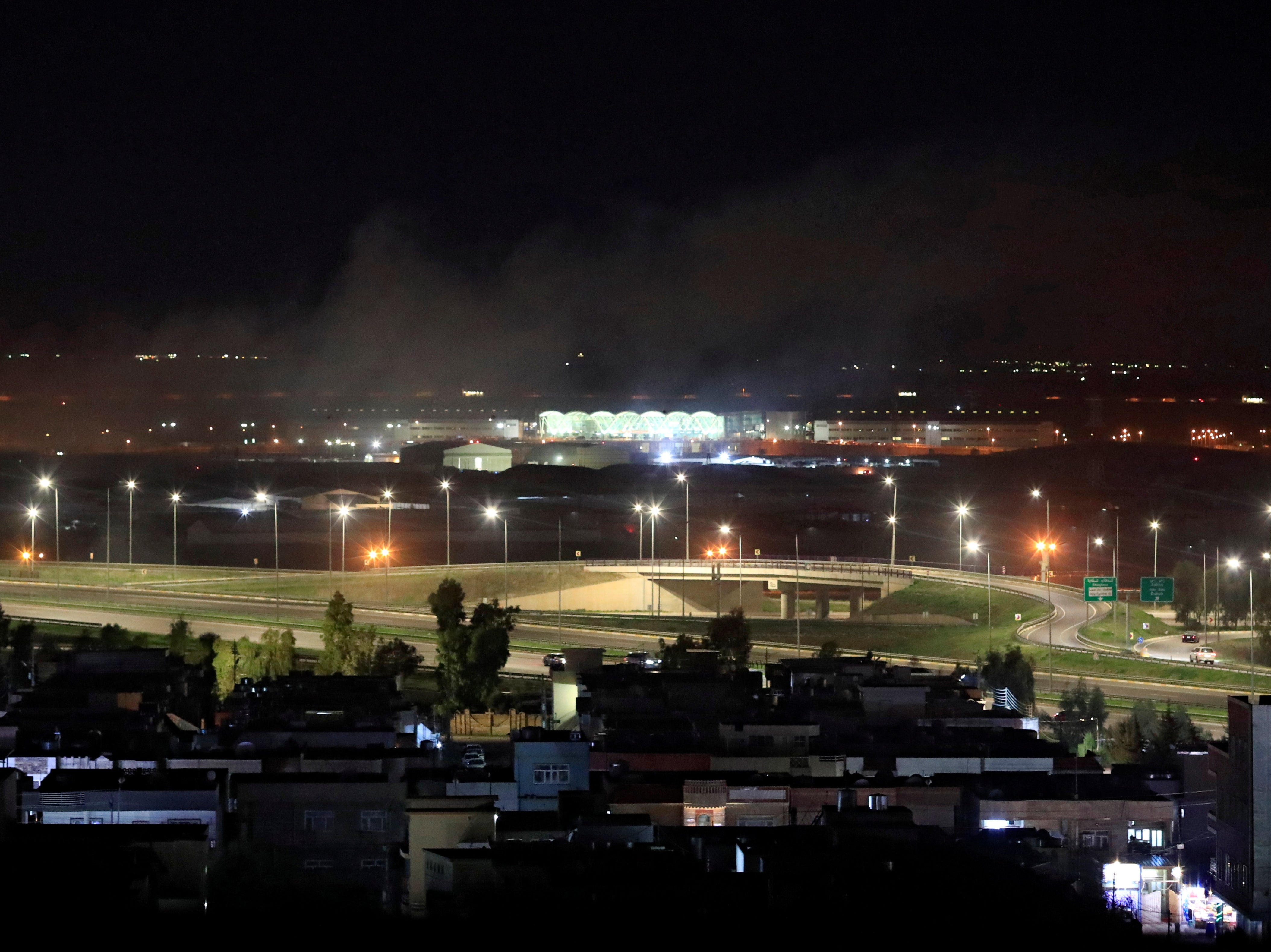 Smoke rises over Erbil after rockets landed near the international airport in Iraqi Kurdistan