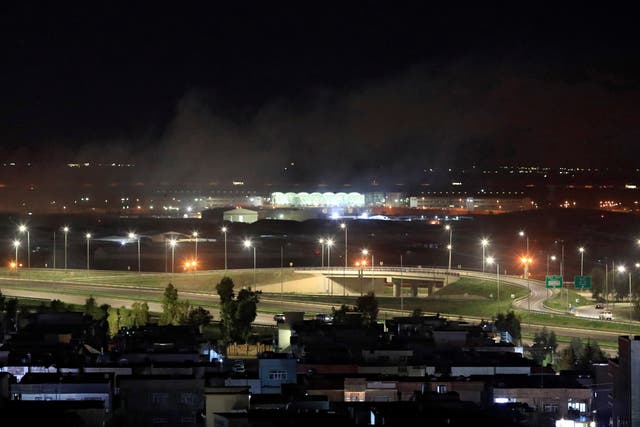 <p>Smoke rises over Erbil after rockets landed near the international airport in Iraqi Kurdistan</p>