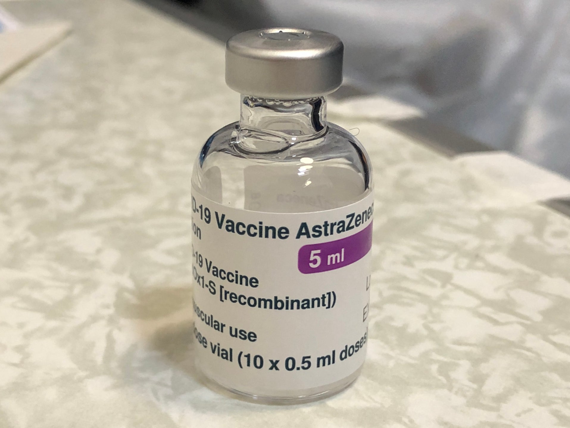 Vauxhall Astra: a phial of coronavirus vaccine at a centre in London SE11
