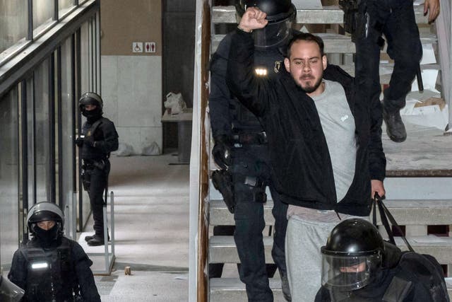 <p>Catalan rapper Pablo Hasel is arrested by police at the University of Lleida, 150 kms (90 miles) west of Barcelona, on February 16, 2021 where he had barricaded himself.</p>