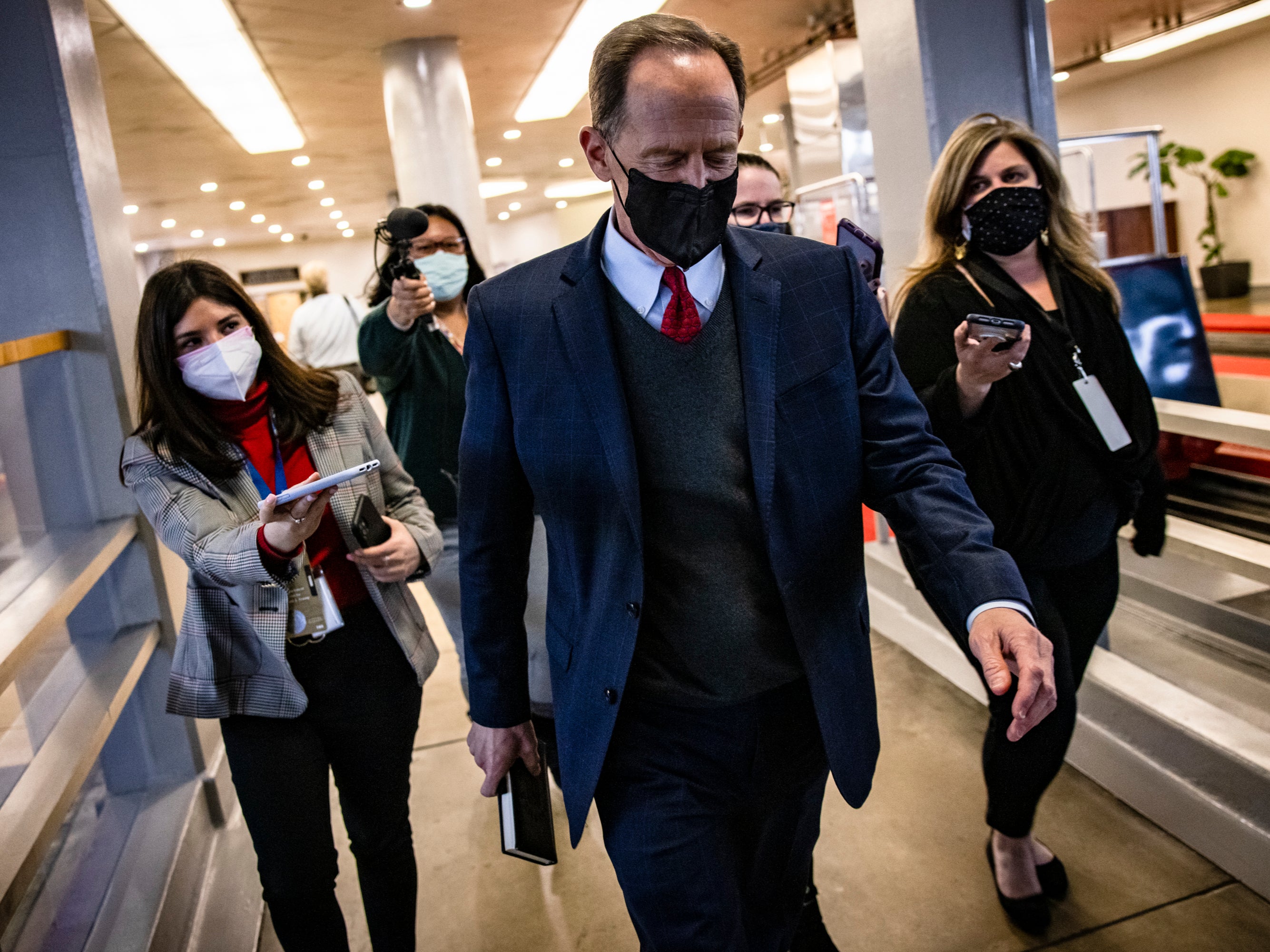 Senator Pat Toomey (R-PA) walks through the Senate subway at the conclusion of former President Donald Trump's second impeachment trial February 13, 2021 in Washington, DC