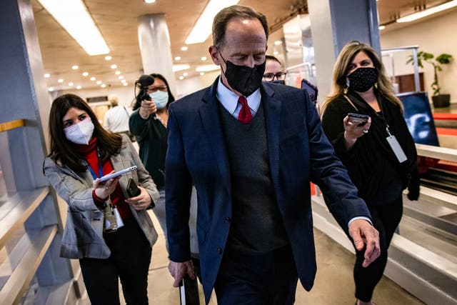 <p>Senator Pat Toomey (R-PA) walks through the Senate subway at the conclusion of former President Donald Trump's second impeachment trial February 13, 2021 in Washington, DC</p>