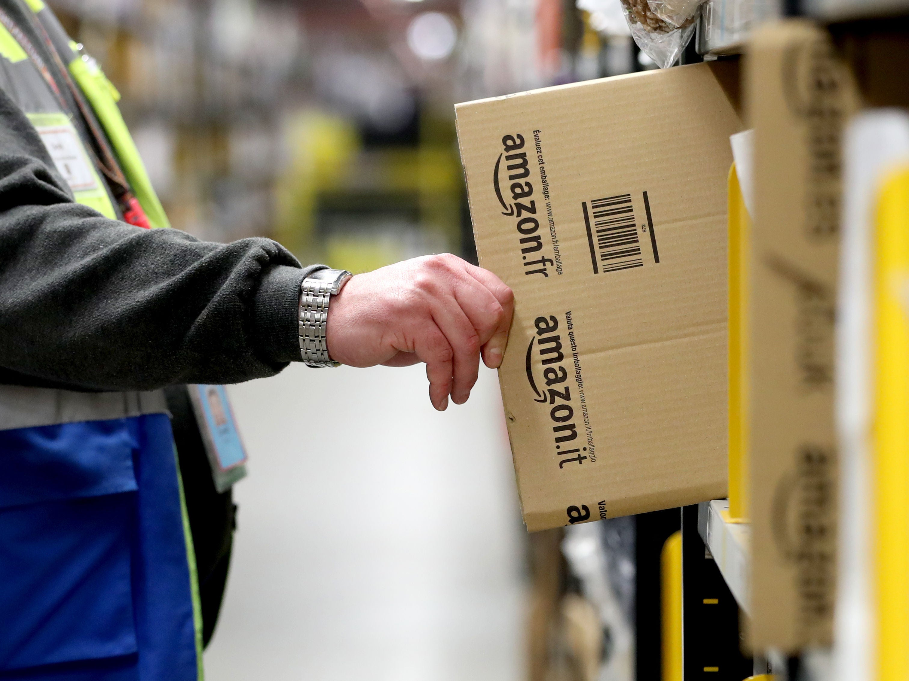 An Amazon associate collecting packaging at the Dunfermline fulfilment centre, Fife