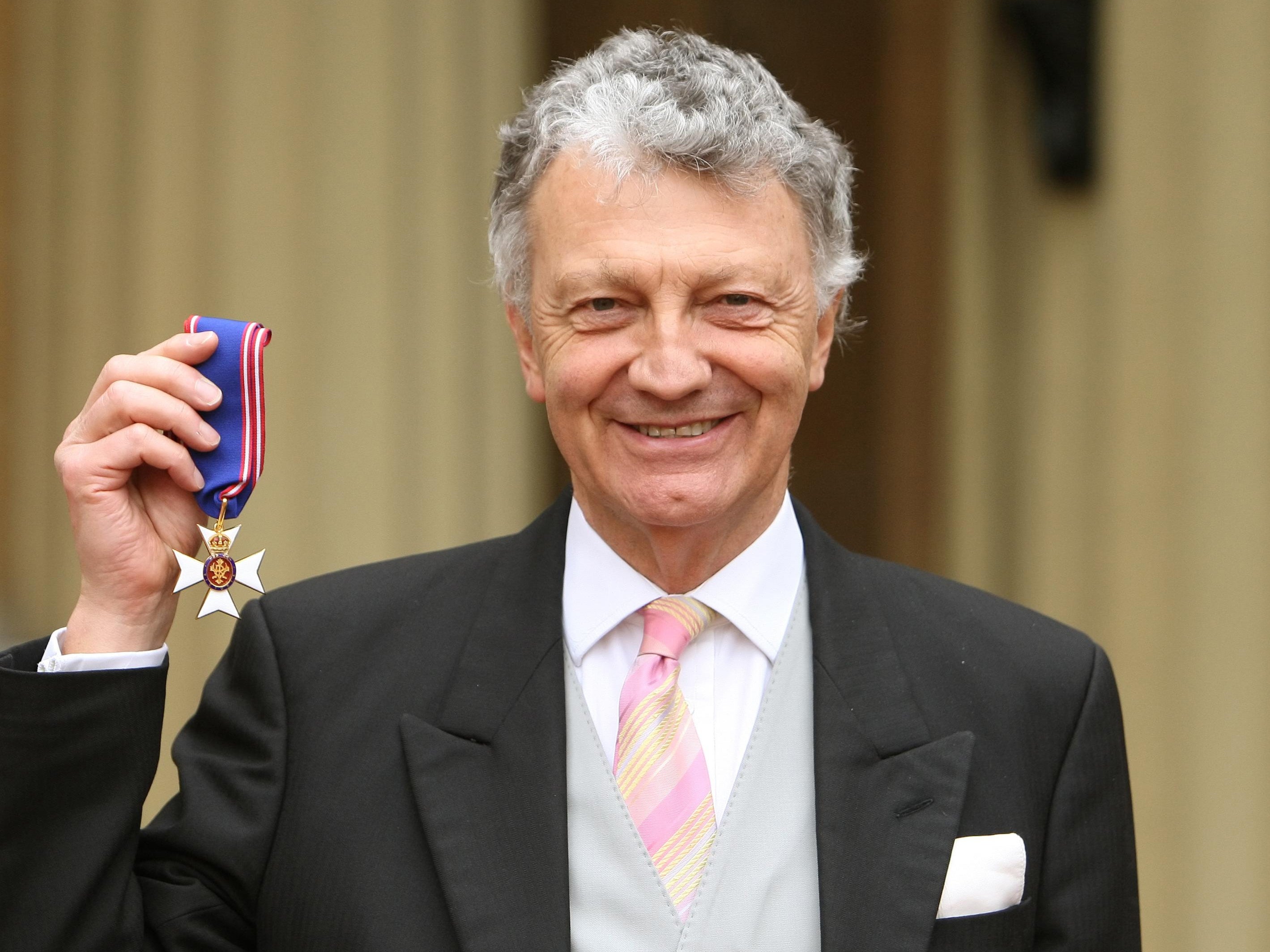 William Shawcross with his Commander of the Royal Victorian Order (RVO) medal, during an investiture ceremony at Buckingham Palace on 10 March 2011