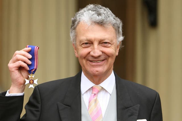 William Shawcross with his Commander of the Royal Victorian Order (RVO) medal, during an investiture ceremony at Buckingham Palace on 10 March 2011 