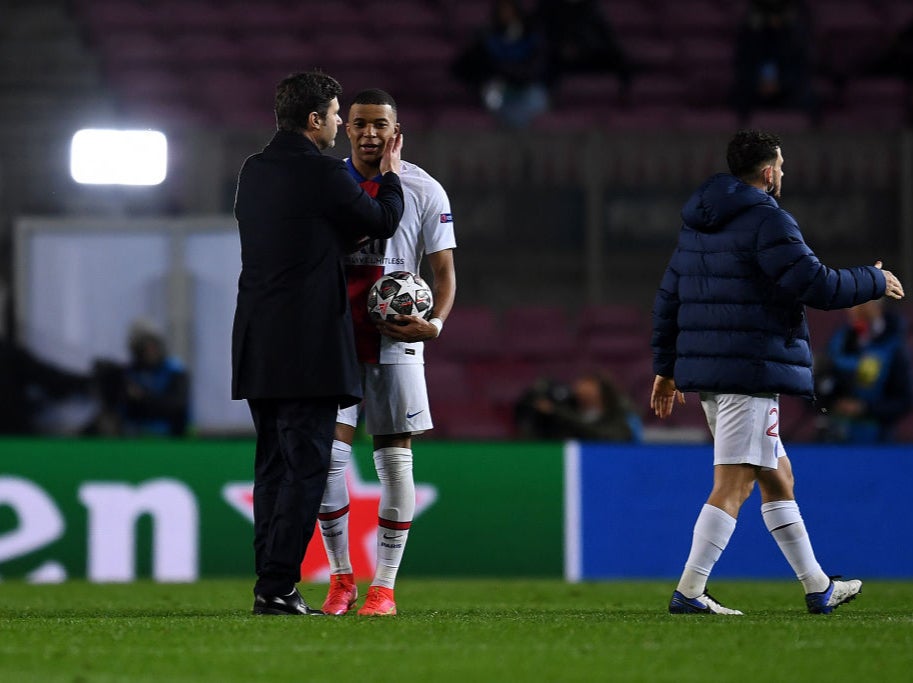 Kylian Mbappe is embraced by Mauricio Pochettino at full-time