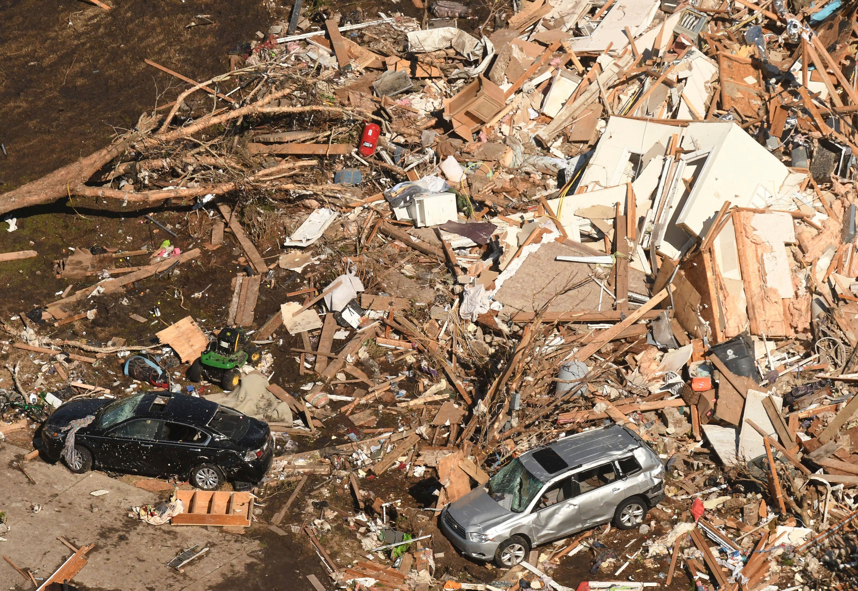 Cars were damaged and were seen sitting on the pile of debris