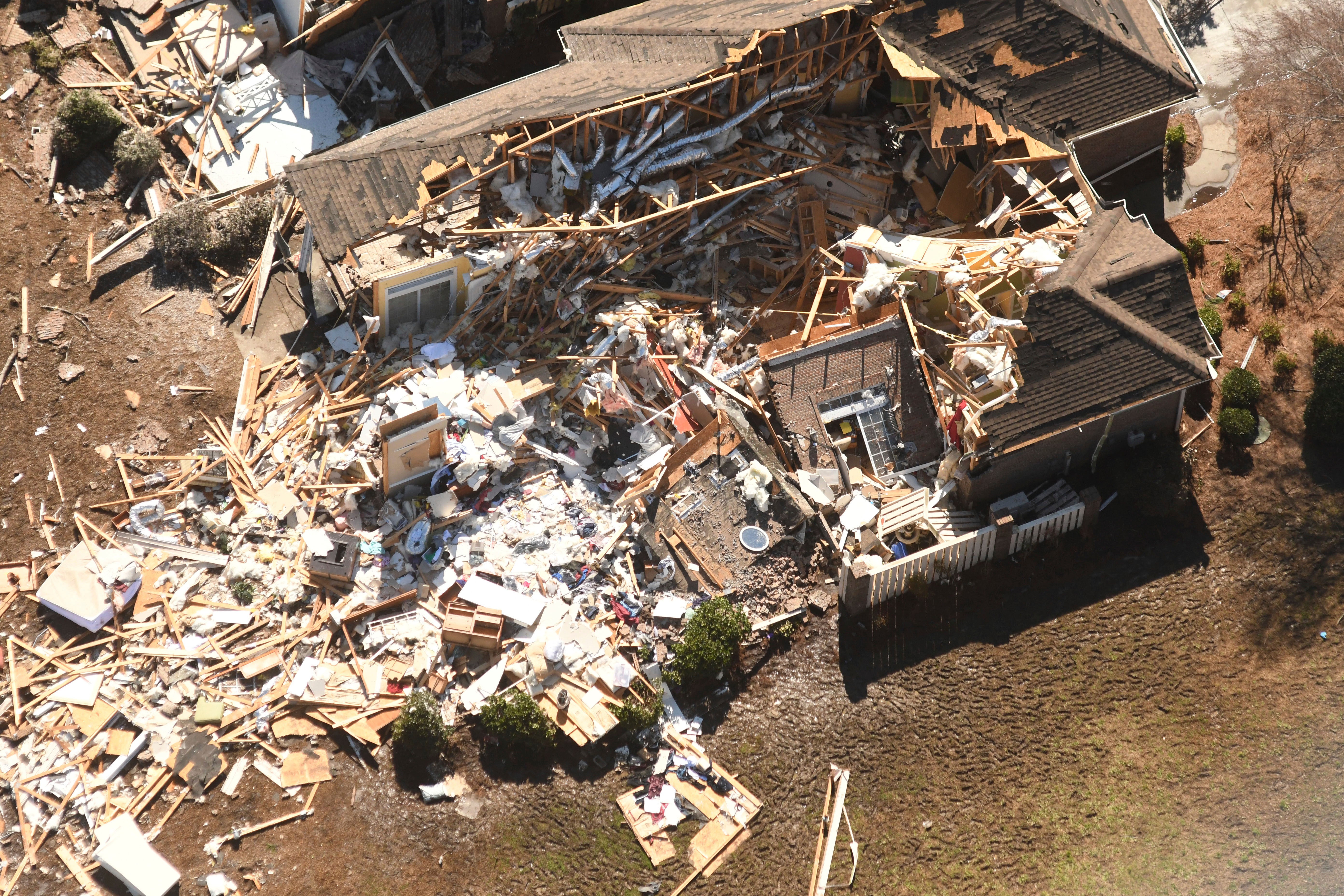 A aerial picture of the tornado hit area shows a house completely damaged