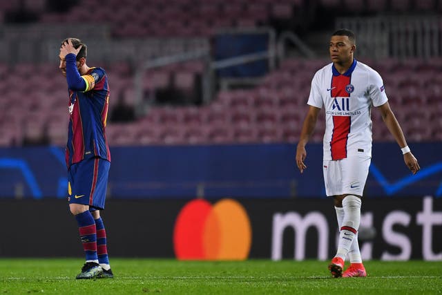 Lionel Messi shows his dejection next to Kylian Mbappe
