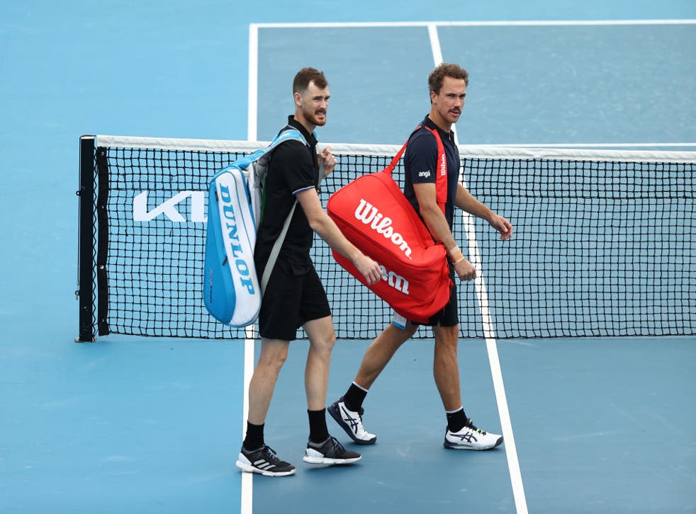 <p>Jamie Murray of Great Britain and Bruno Soares of Brazil walk off the court</p>