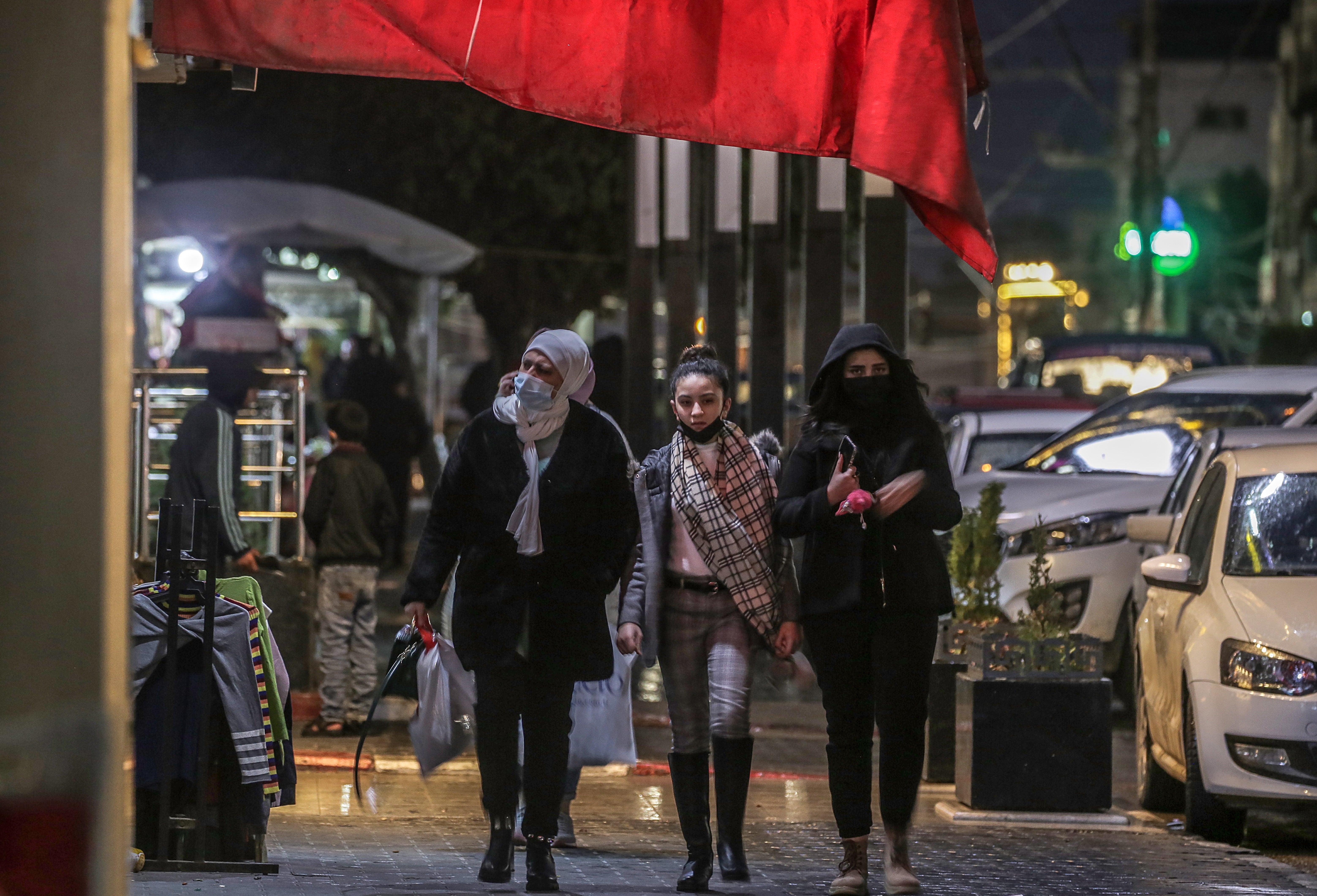 Palestinians wearing face masks in Gaza City