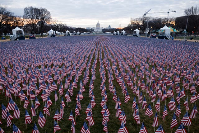 <p>Thousands of US flags are seen at the National Mall, as part of a memorial paying tribute to the U.S. citizens who have died from the coronavirus disease (COVID-19), near the Capitol ahead of President-elect Joe Biden’s inauguration, in Washington, DC, on 18 January 2021</p>