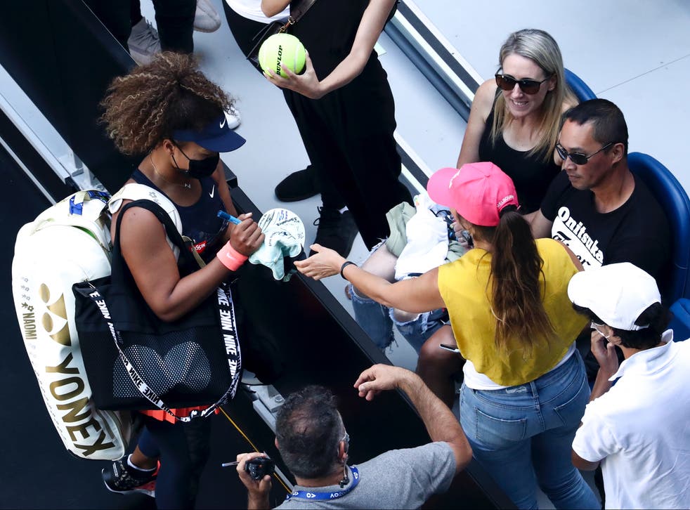 Naomi Osaka signs autographs for fans