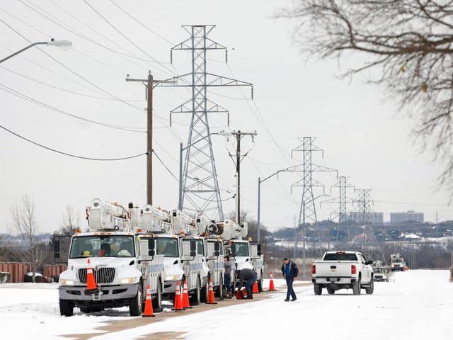 <p>Pike Electric service trucks line up after a snow storm on 16 February, 2021 in Fort Worth, Texas</p>