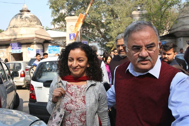 <p>Indian journalist Priya Ramani smiles as she leaves Patiala House Court in New Delhi</p>