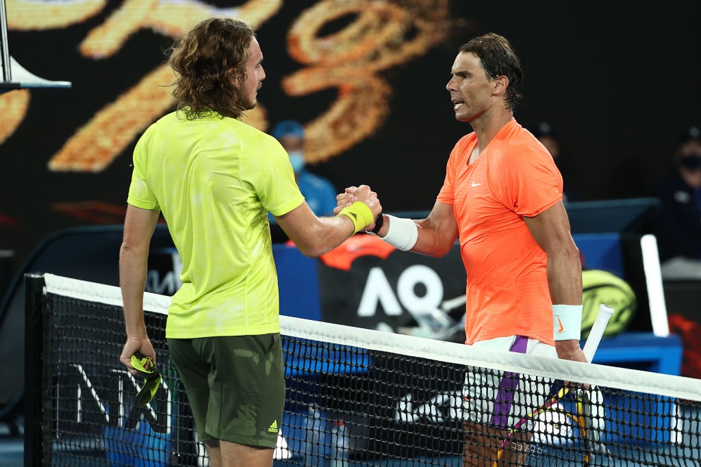 Stefanos Tsitsipas embraces Rafael Nadal at the net after his stunning win