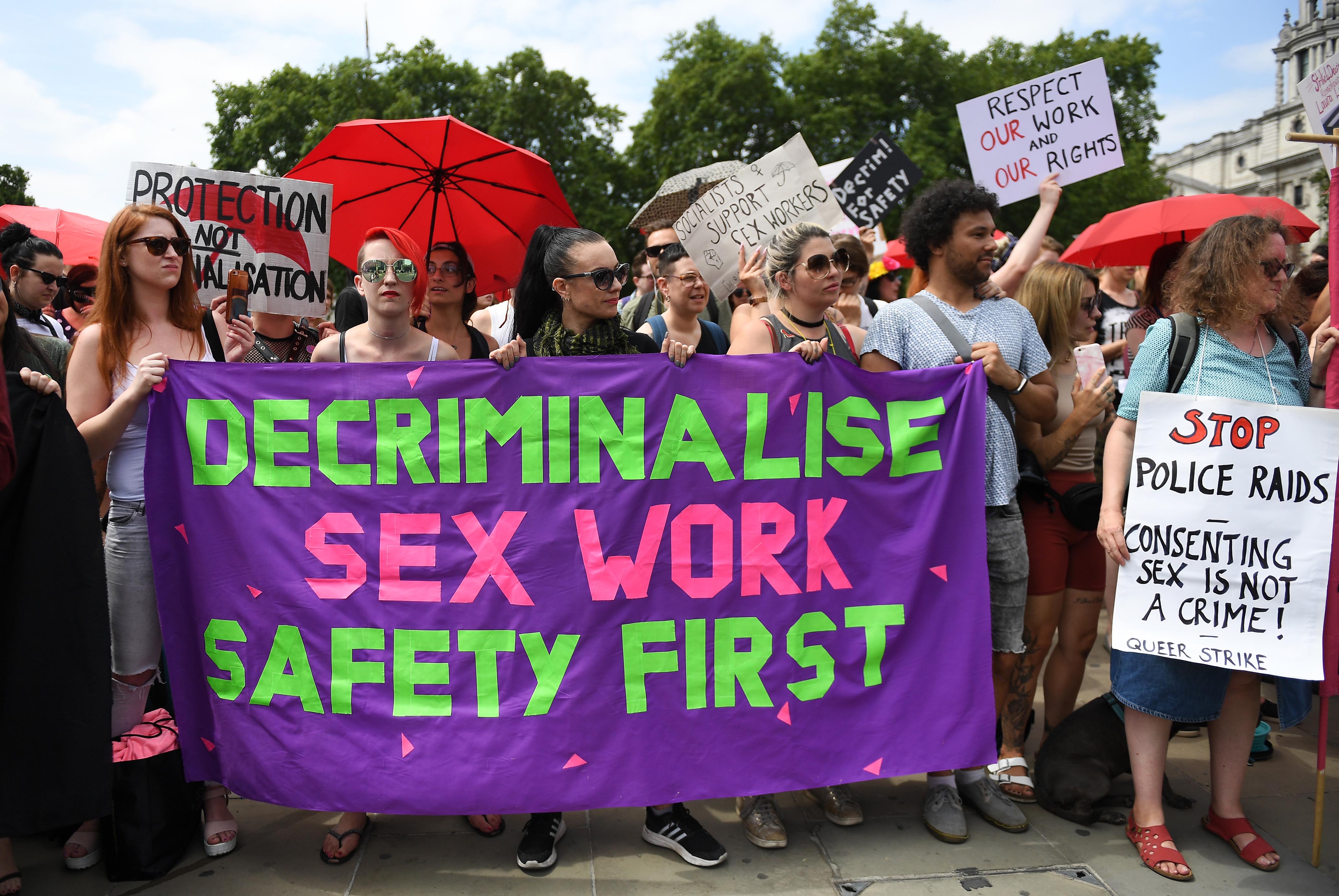 Sex workers protesting to demand workers’ rights outside parliament in London in 2018