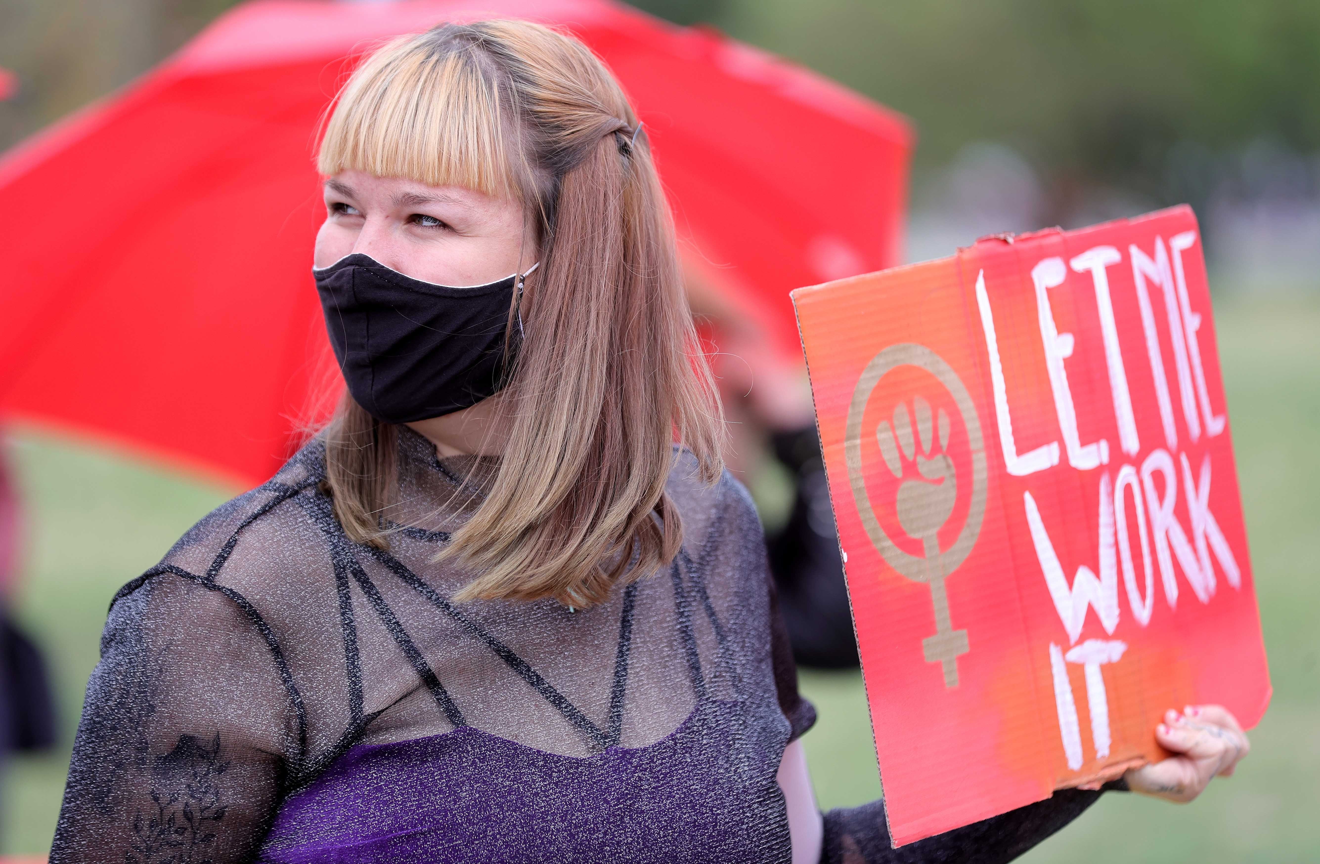 Activists march with placards during a protest to demand an end to the prohibition of sex work due to the coronavirus crisis in Germany