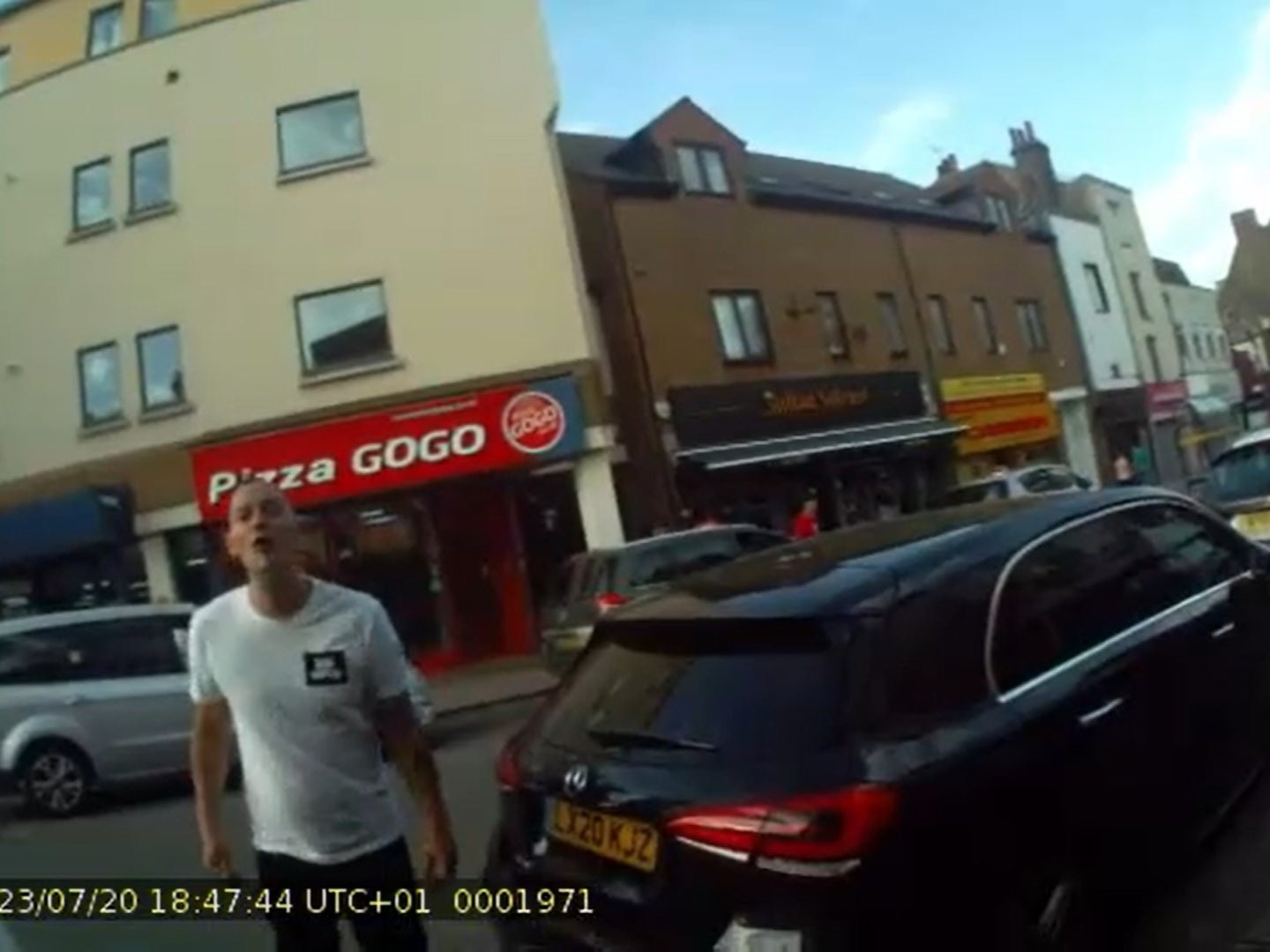 <p>Screengrab taken from footage issued by Gravesham Borough Council showing Graham Swinbourne spitting at a parking warden and telling him “I have Corona”</p>