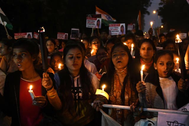 <p>File image: Indian women rights activists during a candle light march in December 2019 to denounce violence against women</p>